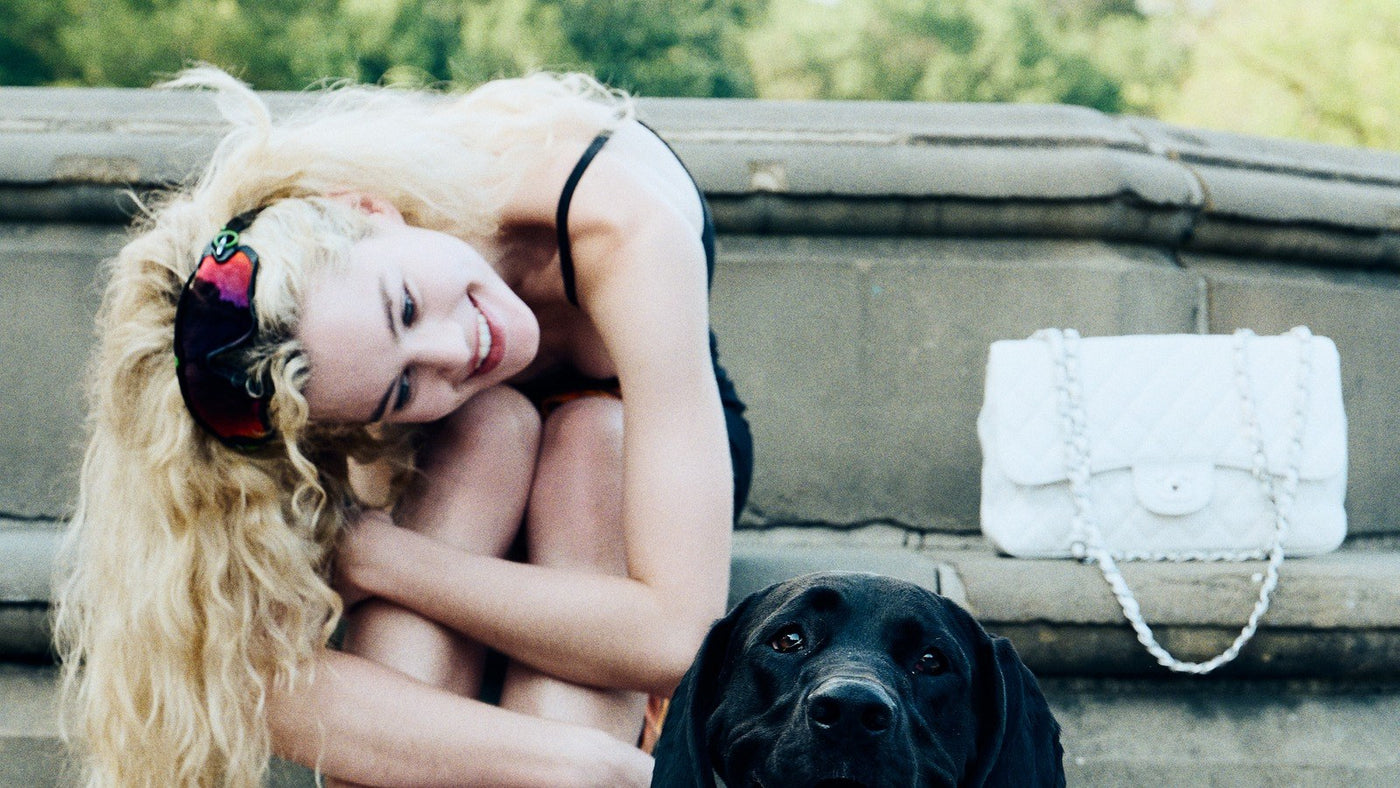 A pet parent hugging a dog with healthy skin and a soft, shiny coat