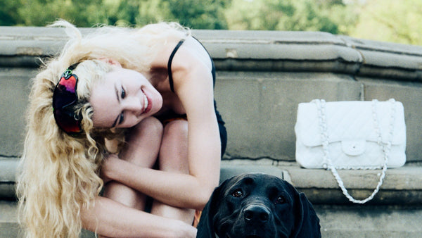 A pet parent hugging a dog with healthy skin and a soft, shiny coat