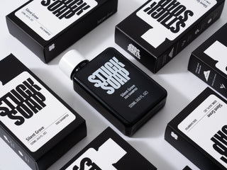 Black Silent Grove 120 ml bottle lying among several Silent Grove cartons, seen from above
