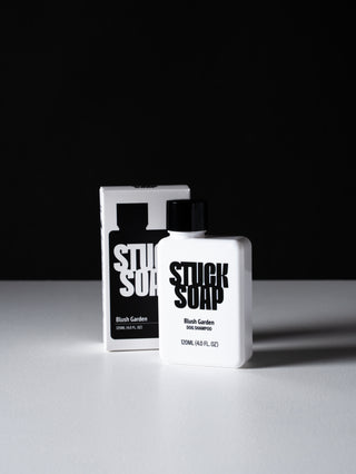 White Blush Garden 120 ml bottle standing beside its carton on a white surface, black background