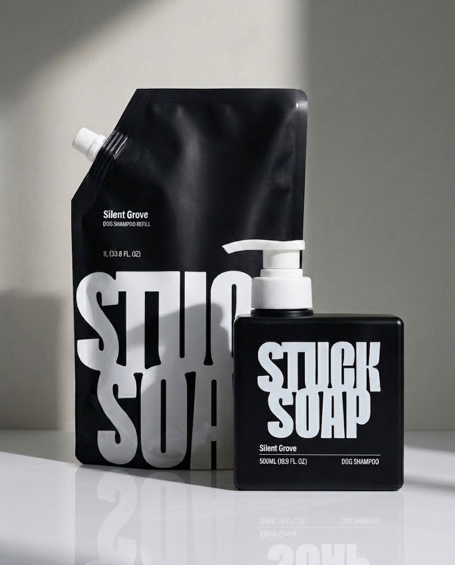 Black Silent Grove 1 L refill pouch standing behind a black Silent Grove 500 ml pump bottle